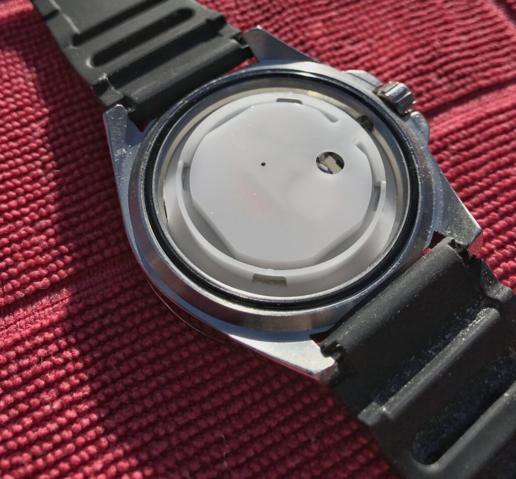 Casio watch movement cover.